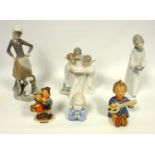 Lladro girl with goose, girl with chamberstick, Ilmenau girl praying, Nao three angels, and Goebel