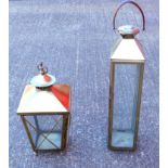 Two contemporary brass lanterns, one with leather carrying handle, 78 cm high