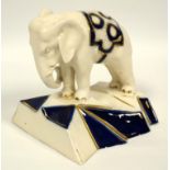 Royal Dux Art Deco single elephant bookend, decorated in blue and gilt, 14 x 15.5 cm