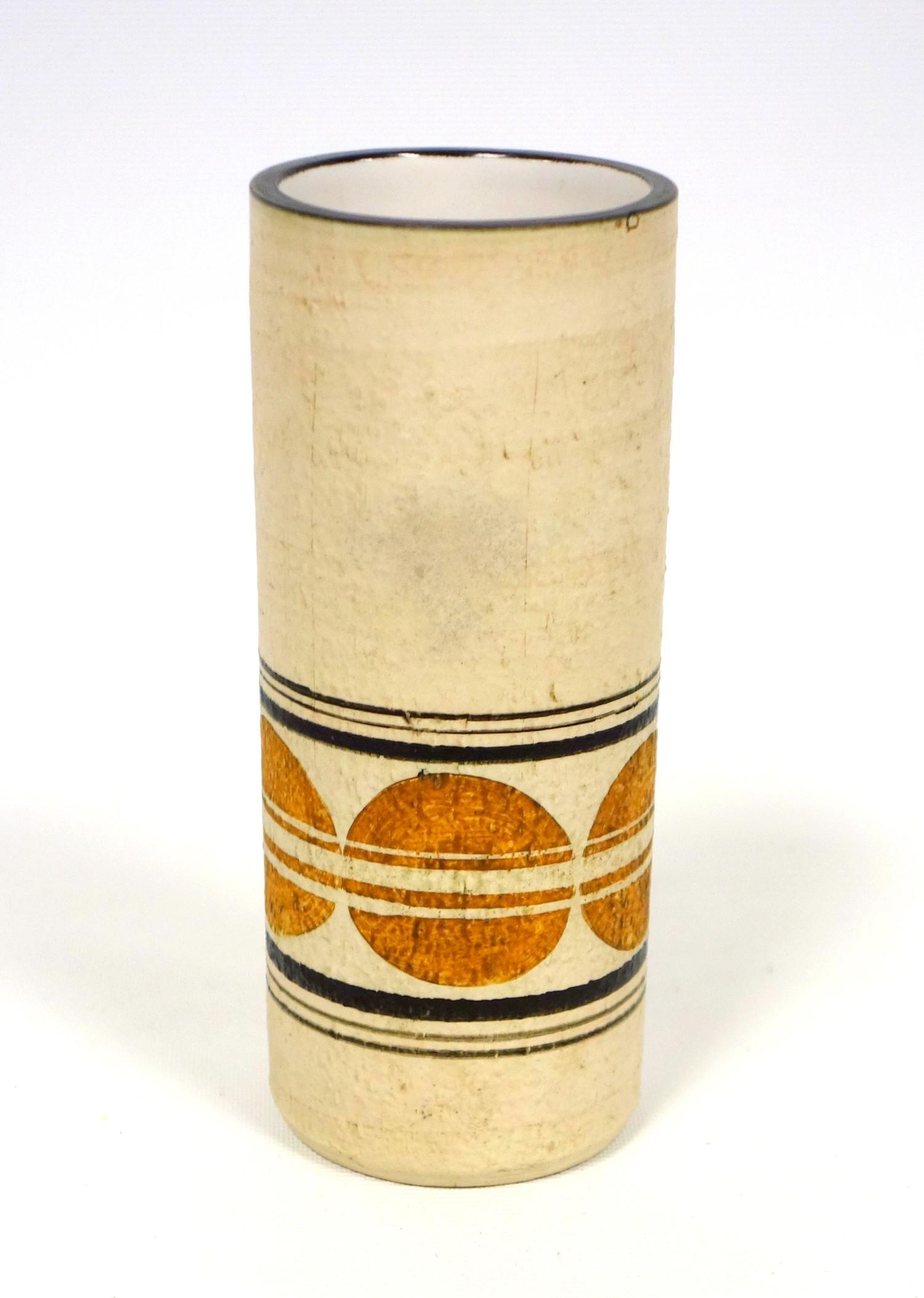 Troika cylindrical vase with orange sliced circle decoration, marked with artists mongram, 14 cm