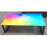 Glass topped coffee table with brightly coloured design, on black metal base 32 x 104 x 45 cm