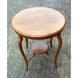 A Edwardian circular lamp table with undertier, carved oval side table on barley twist legs and a