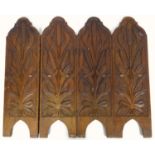 Carved concertina fire screen, each panel carved with formal design of bull rushes, height 60 cm