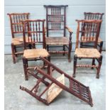 Set of six oak Lancashire dining chairs, with spindle backs and rush seats, five chairs and one