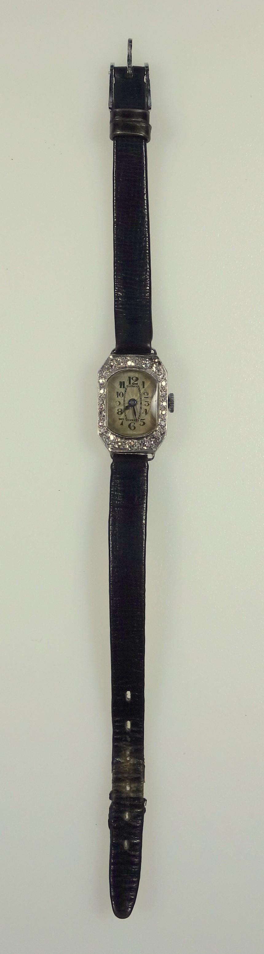 Edwardian cocktail watch set with diamonds in platinum, dial with engine turned decoration, total