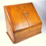 Victorian oak stationery cabinet, the two doors opening to reveal a letter rack and pen tray, 27 x