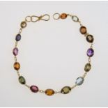 Gold bracelet set with coloured gems, sapphires, amethyst topaz and citrines, length 16.5 cm