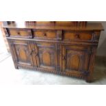 Carved oak sideboard, of three drawers over three cabinets, with arch carving, 91 x 168 x 50 cm
