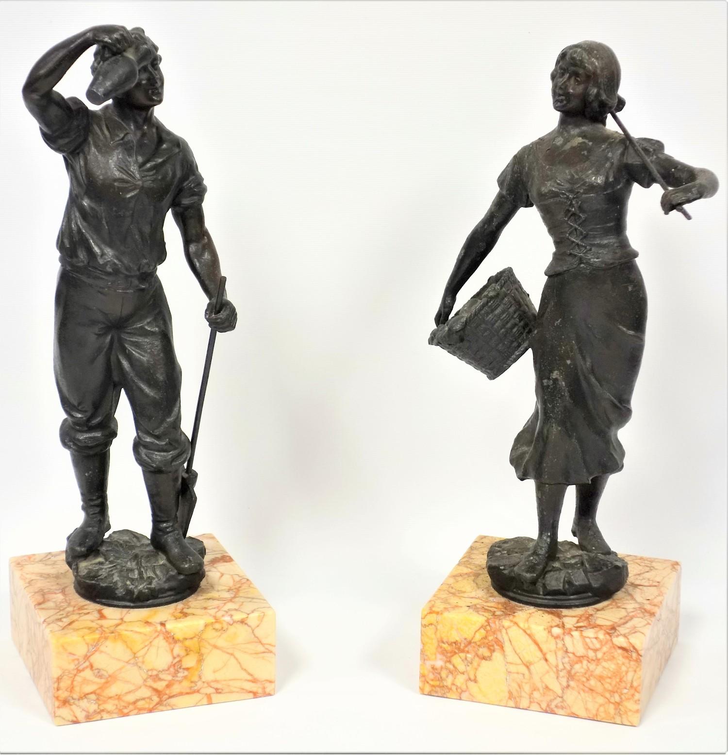 A pair of 19th C. French spelter figures, the girl carrying a basket of fruit, the boy holding a