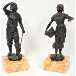A pair of 19th C. French spelter figures, the girl carrying a basket of fruit, the boy holding a