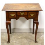 Georgian walnut lowboy, with cross banding, three drawers with brass handles and engraved back.