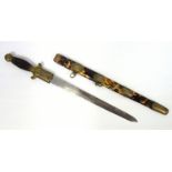 Chinese short sword, steel blade in tortoiseshell scabbard, the brass mounts engraved with symbols