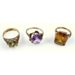 Three vintage dress rings,an amethyst set ring, another with lemon quartz, and one other, all marked