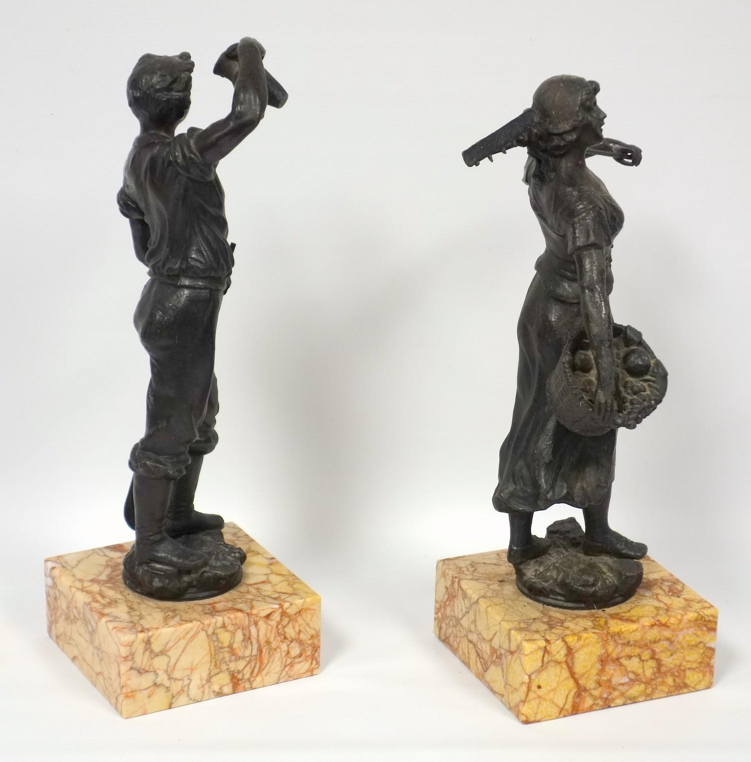 A pair of 19th C. French spelter figures, the girl carrying a basket of fruit, the boy holding a - Image 3 of 4