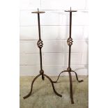 A pair of wrought iron candlestands, 115 cm high