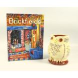 Mary Wondrausch, an owl jug with slipware and painted decoration, 12 cm and a copy of the book