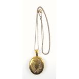 Victorian two-colour gold locket, with relief decoration of oak leaves and acorns, reverse with