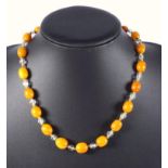 1920?s Amber and crystal necklaces, length 104 cm, largest bead 21 x 17 mm, gross weight (