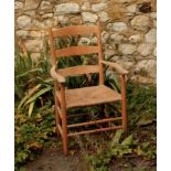 Cotswold School style chair in ash wood with triple curved back rail and rush seat. Provenance: