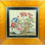 Three mid-19th C. needlework pictures, one with a bird and flowers in a basket, another with