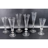 Six 19th C. Champagne glasses, all with knopped stems five with faceted bowls and one plain with