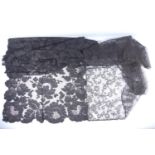 French black silk lace stole with large scale design of flowers and scalloped edge, C. 1900, 43 x