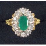 Emerald and diamond dress ring emerald 8 x 5 mm, stamped 18 ct gold, ring size L/12