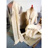 Woven fabric, a number of unused bolts, natural cream with taupe and brown, various weave designs,