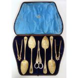 Set of four George IV silver gilt Old English pattern fruit serving spoons with all-over chased