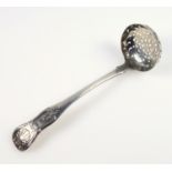 William IV King's pattern silver sifter spoon, with shell motif, engraved with a winged beast,