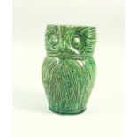 Harris Pottery Farnham a green glazed owl jug, with incised decoration and pronounced beak,