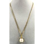 Mabe pearl pendant set in 18ct gold, 5.9 grams gross and a 9ct gold flat link chain, 6.9 grams (2)