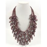 Garnet and cultured pearl garland necklace.