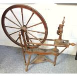 A rare Irish motif spinning wheel by James McCreery of Belfast, carved with shamrock, the base