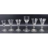 Group of antique drinking glasses, an 18th C. wine glass with faceted stem, a moulded glass with