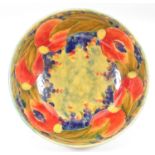 Moorcroft for Liberty & Co., a large bowl in pomegranate and grape design, on a ochre ground, signed