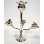 Silver presentation centrepiece with a central vase surrounded by three detachable vases on a