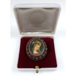Hand painted portrait of a lady, in filigre mount, marked 800, a silver bangle with engraved