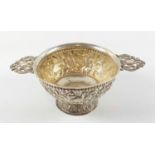 Eastern circular bowl with chased and embossed bird, floral and bead decoration, two pierced lobed