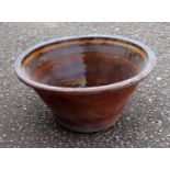 Large antique Welsh dough bin with brown glaze and slip decoration, 54 cm diameter. Provenance:
