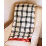 Antique Welsh heavyweight blanket with a simple plaid pattern black on cream, two sides with red