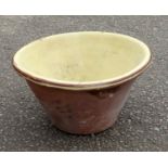 Large antique Welsh earthenware dairy/dough bowl with yellow glazed interior and roll over lip, 61