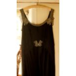 1930's evening dress, of black silk satin, beaded ribbon and shoulders, bias cut skirt, the
