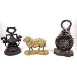 Victorian cast iron door stop, cast iron urn form door stop and a brass sheep door stop (3).