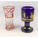 Bohemian ruby flash vase decorated with vines, 15.5 cm and a cobalt goblet with gilt decoration of