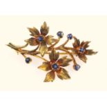 Vintage floral spray brooch, set with sapphires, London 1976 hallmarks for 9 ct gold, 4.5 cm