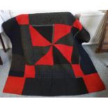 Welsh patchwork quilt 19th C., with bold geometric design, hand stitched wool in black, grey, red