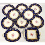 Edwardian Coalport dessert service, with gilt decoration on a blue ground and floral painted centre,