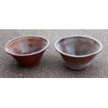 Two antique Welsh Dough or Pippin bowls, one plain and another with slip banding, each 54-55 cm
