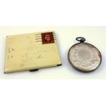 Enamelled novelty compact in the form of a stamp & letter envelope, and a silver medal awarded by
